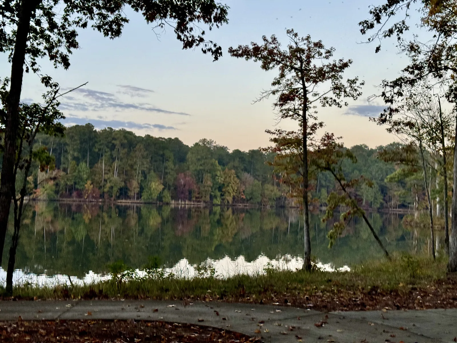 Autumn dusk on Lake Oconee, with the wooded far shore reflected in still water