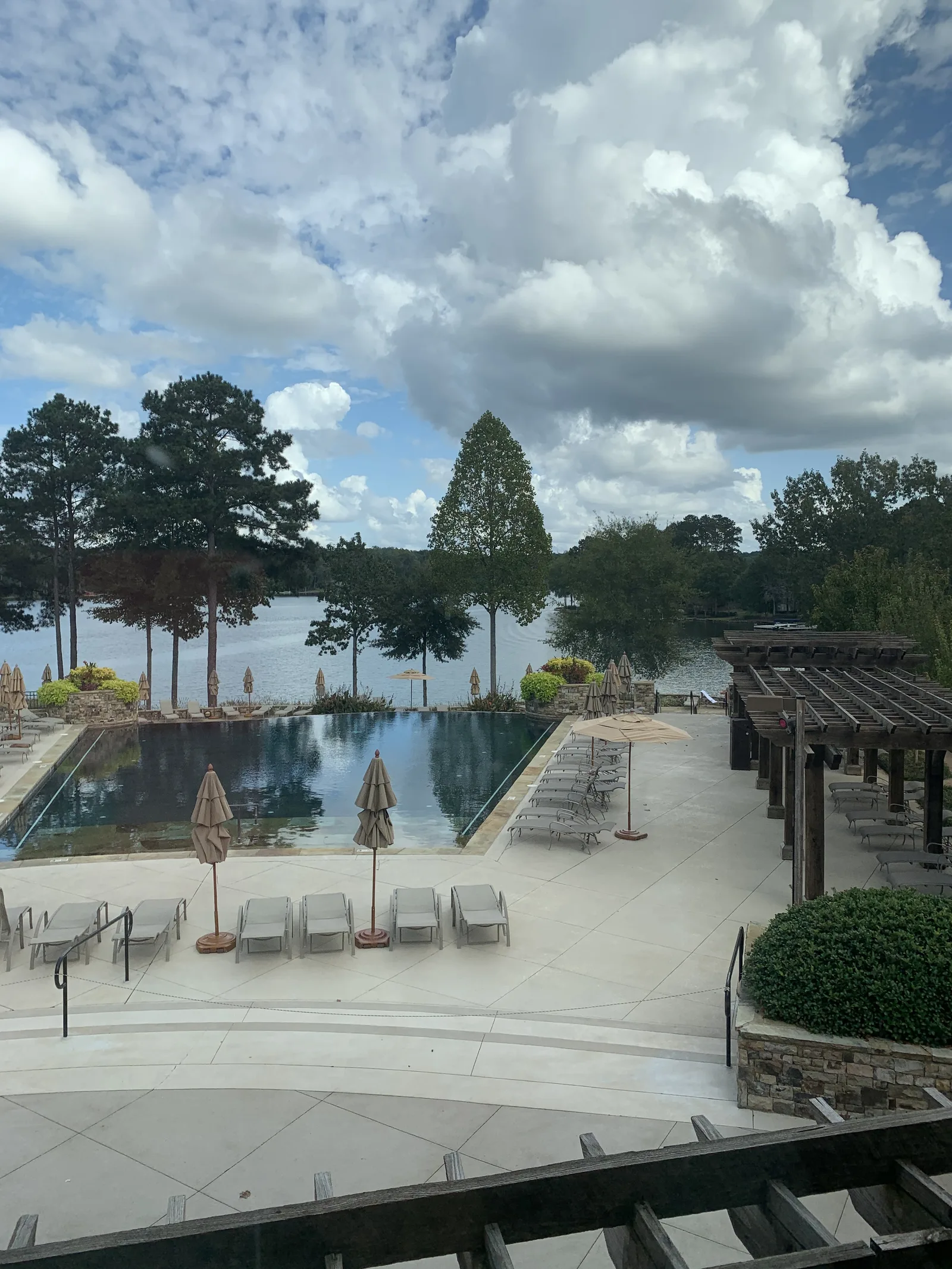 Pool beside Lake Oconee under big summer clouds